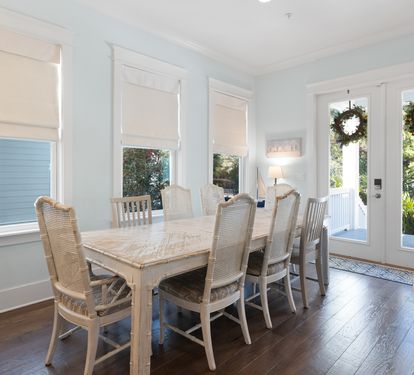 Gather around this elegant dining table where shared meals become cherished memories, with French doors opening to your private outdoor retreat.