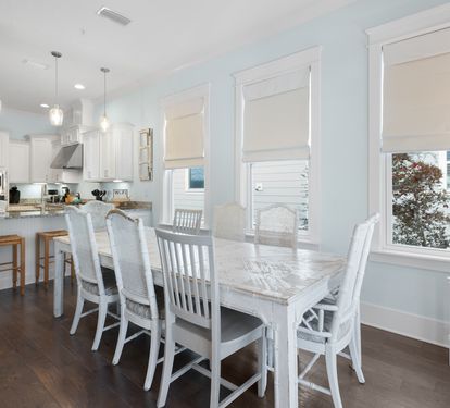 Your bright, open kitchen flows seamlessly into the dining area, where you'll share memorable meals at the stunning marble table.