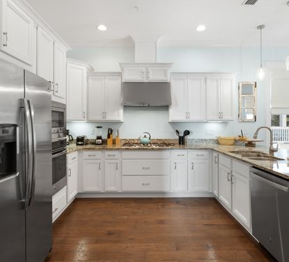 Your gourmet kitchen awaits with gleaming granite counters, stainless steel appliances, and all the space you need to create memorable meals together.
