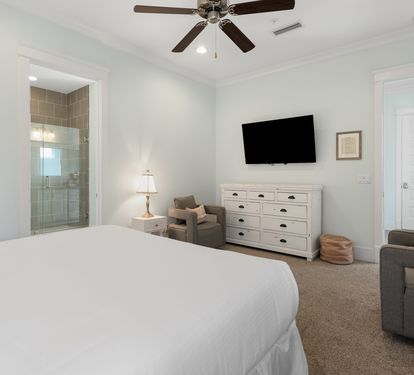 Your spacious master bedroom features a cozy seating area and private ensuite bathroom for ultimate comfort and relaxation.