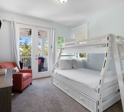 Your kids will love this cozy bedroom with sturdy white bunk beds and their own TV for movie nights.