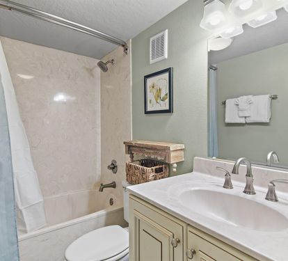 Step into your serene bathroom oasis with elegant marble tub, stylish vanity, and thoughtful coastal touches that make your daily routine feel luxurious.