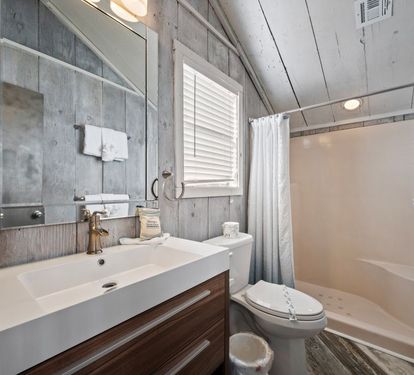 The Beach Shack Primary Bathroom with Step-in Shower