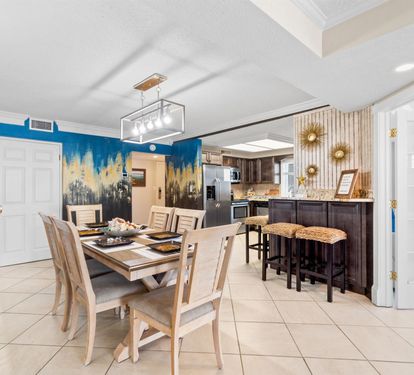 Your open dining area flows seamlessly into a fully equipped kitchen, perfect for memorable meals together.
