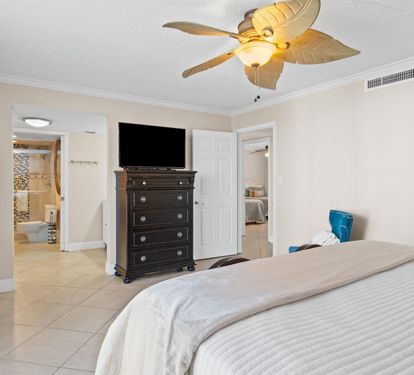 Unwind in your spacious master suite with elegant furnishings, ceiling fan comfort, and entertainment at your fingertips.