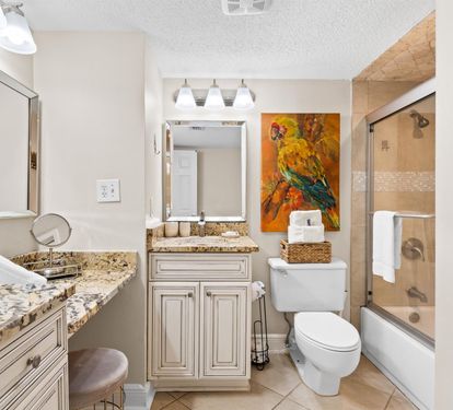 Unwind in your elegant bathroom featuring granite countertops, dual vanities, and a relaxing tub-shower combo perfect for refreshing after your adventures.