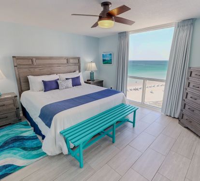 Wake to stunning ocean views from your cozy bedroom, complete with beach-inspired décor and modern comfort.