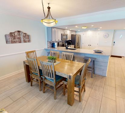 Gather around your spacious dining table for memorable meals, with a fully equipped kitchen ready for culinary adventures in your bright, welcoming home.