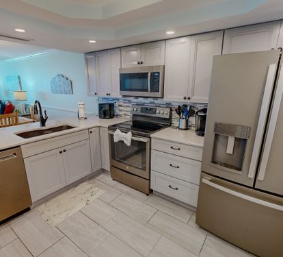 Your fully equipped kitchen features modern stainless steel appliances, granite countertops, and everything you need to create memorable meals during your stay.