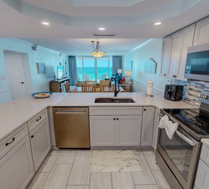 Your fully equipped kitchen features modern appliances and ocean views, perfect for creating memorable meals while staying connected to paradise.