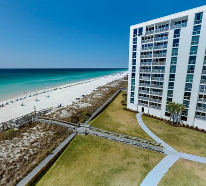 Stunning beachfront property with direct access to pristine white sand beaches and crystal-clear Gulf waters.