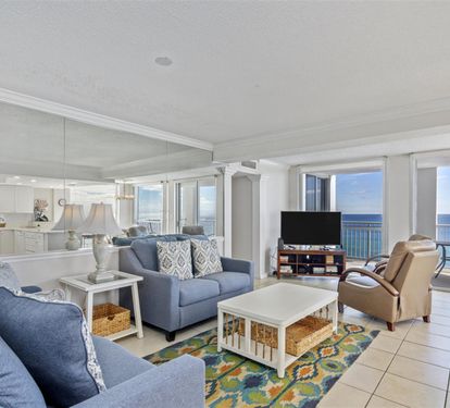 Unwind in your spacious living room where ocean views fill every window and coastal breezes invite relaxation.