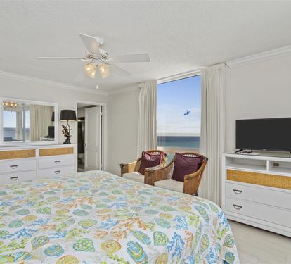 Wake up to stunning ocean views from your comfortable bed, with wicker chairs perfect for morning coffee and breathtaking sea scenes.