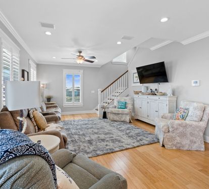 All Moh's Paradise Living Room with Mounted Smart TV