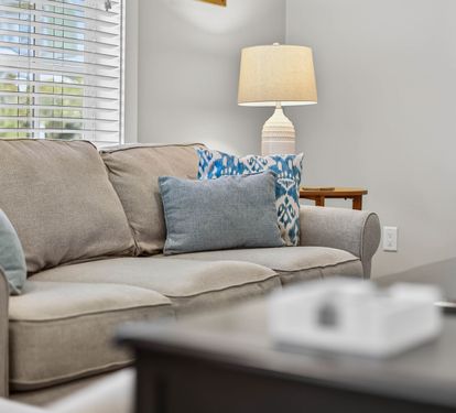 Sink into this plush sofa with your favorite book, surrounded by thoughtful touches that make this space feel like home.