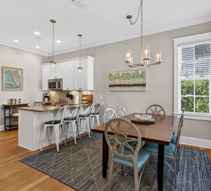 Gather around your elegant dining table for memorable meals, while the open kitchen invites culinary adventures with granite counters and modern appliances.