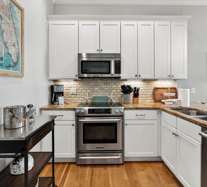 Your fully equipped kitchen awaits with granite countertops, stainless appliances, and everything needed for memorable meals together.
