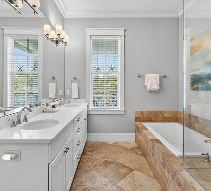 Unwind in your spa-like ensuite with dual vanities, soaking tub, and walk-in shower—perfect for relaxing after exploring.