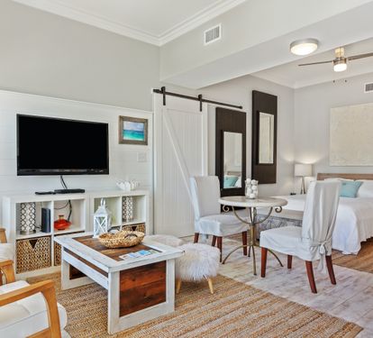 Cozy 30A studio with a queen bed, sleeper sofa, and coastal décor—just a short walk to the beach. Bright, open layout with TV, dining area, and beachy charm throughout.