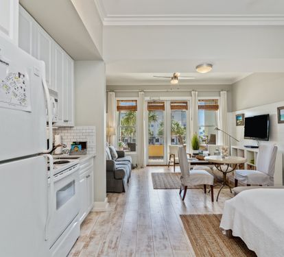 Bright 30A studio with a full kitchen, queen bed, sleeper sofa, and sunny balcony access. Steps from the beach, it’s the perfect blend of comfort and coastal style.
