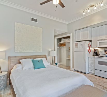 Relaxing studio layout with a plush queen bed, full kitchen, and modern coastal design—ideal for a stylish and comfortable 30A getaway.