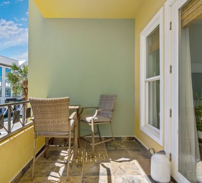 Private balcony with comfortable seating—the perfect place to relax and enjoy the coastal breeze.
