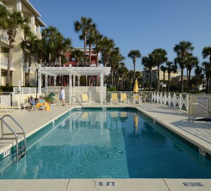 Whether you're swimming or lounging poolside, this peaceful oasis is the perfect place to unwind after a day on the Gulf.