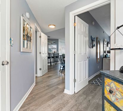 Step into your welcoming hallway where thoughtful touches and warm lighting create an inviting atmosphere that flows seamlessly throughout your home.