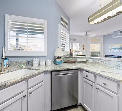 Your spacious kitchen features granite countertops, stainless steel appliances, and coastal touches that make meal prep feel like a breeze.