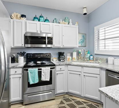 Your fully equipped kitchen features stainless steel appliances and granite countertops, perfect for preparing meals during your stay.
