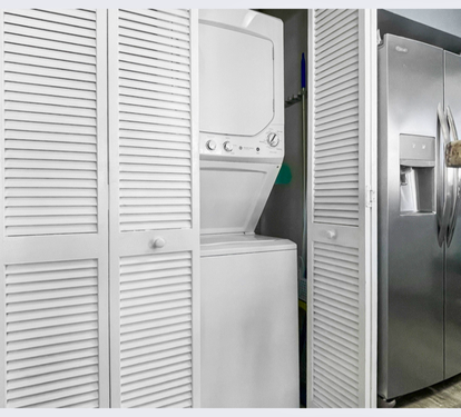 Your in-unit washer and dryer are tucked away behind stylish louvered doors, keeping your vacation wardrobe fresh and ready.