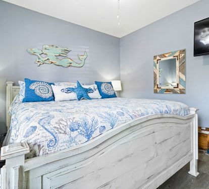 Drift into dreams in your coastal-themed bedroom with ocean-inspired decor and modern amenities.