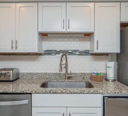 Your fully equipped kitchen features granite countertops, modern appliances, and everything you need to prepare meals at home.