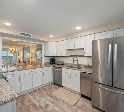 Your fully-equipped kitchen awaits with granite countertops, stainless steel appliances, and everything needed to create memorable meals during your stay.
