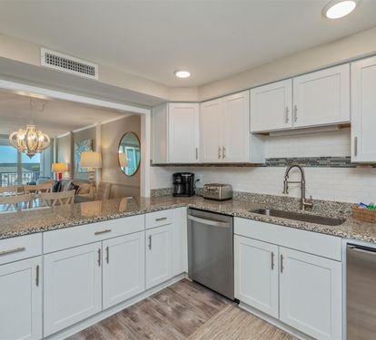 Your sleek kitchen invites culinary adventures with granite countertops, modern appliances, and abundant cabinet space.