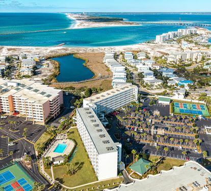 Stunning beachfront resort community featuring multiple pools, tennis courts, and direct beach access in this tropical coastal paradise.