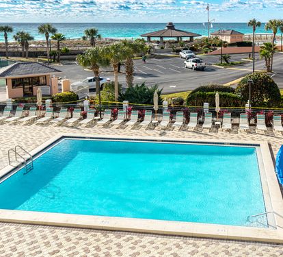 Dive into crystal-clear waters while soaking up stunning ocean views. Your perfect poolside retreat awaits just steps from the beach.