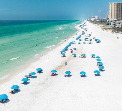 Pristine white sand beaches and turquoise Gulf waters stretch along the shoreline near the property, offering an idyllic coastal setting for your getaway.