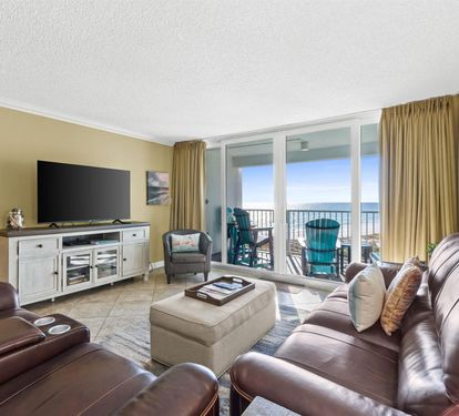 Sink into plush leather seating while enjoying breathtaking ocean views from your private balcony through floor-to-ceiling windows.