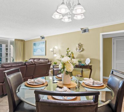 Relax in your spacious living and dining area with stunning ocean views from your private balcony.