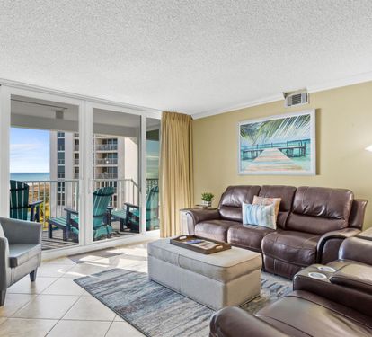 Sink into plush leather seating while enjoying your private balcony with stunning ocean views through floor-to-ceiling windows.