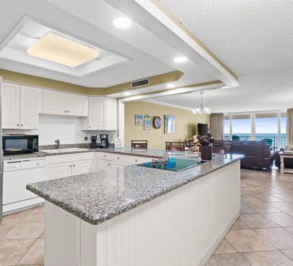 Your spacious kitchen features granite countertops, modern appliances, and an open layout perfect for cooking meals while enjoying ocean views.