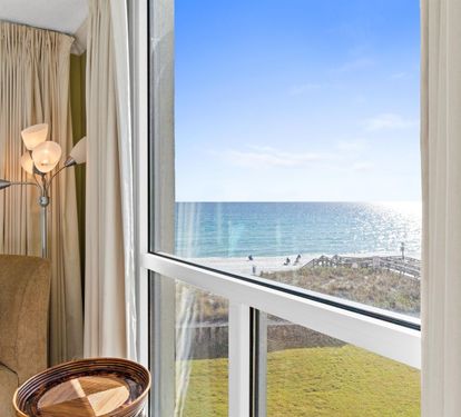 Wake up to this breathtaking ocean view from your window, where sparkling blue waters meet endless skies.