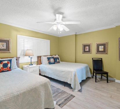 Drift off to sleep in this cheerful twin bedroom, where nautical touches and warm green walls create your perfect coastal retreat.