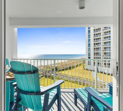 Step out to your private balcony where turquoise chairs invite you to relax with ocean breezes and stunning sea views.