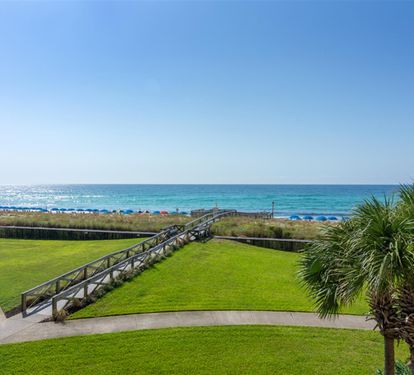 Pristine emerald waters and white sand beach just steps away via the scenic boardwalk from your oceanfront retreat.