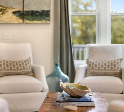 Settle into plush chairs by bright windows where natural light creates the perfect reading nook for your peaceful getaway.