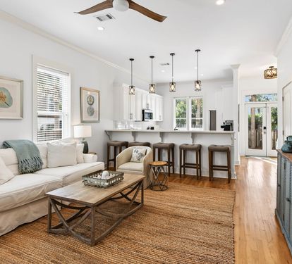 Unwind in your bright, coastal-inspired living space with plush seating, fully equipped kitchen, and charming details that make you feel right at home.