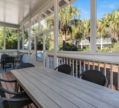 Enjoy your morning coffee on this spacious screened porch where tropical breezes flow through while you dine at the large table.
