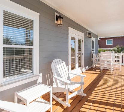Relax on your private deck with Adirondack chairs, perfect for morning coffee or evening conversations in the coastal breeze.